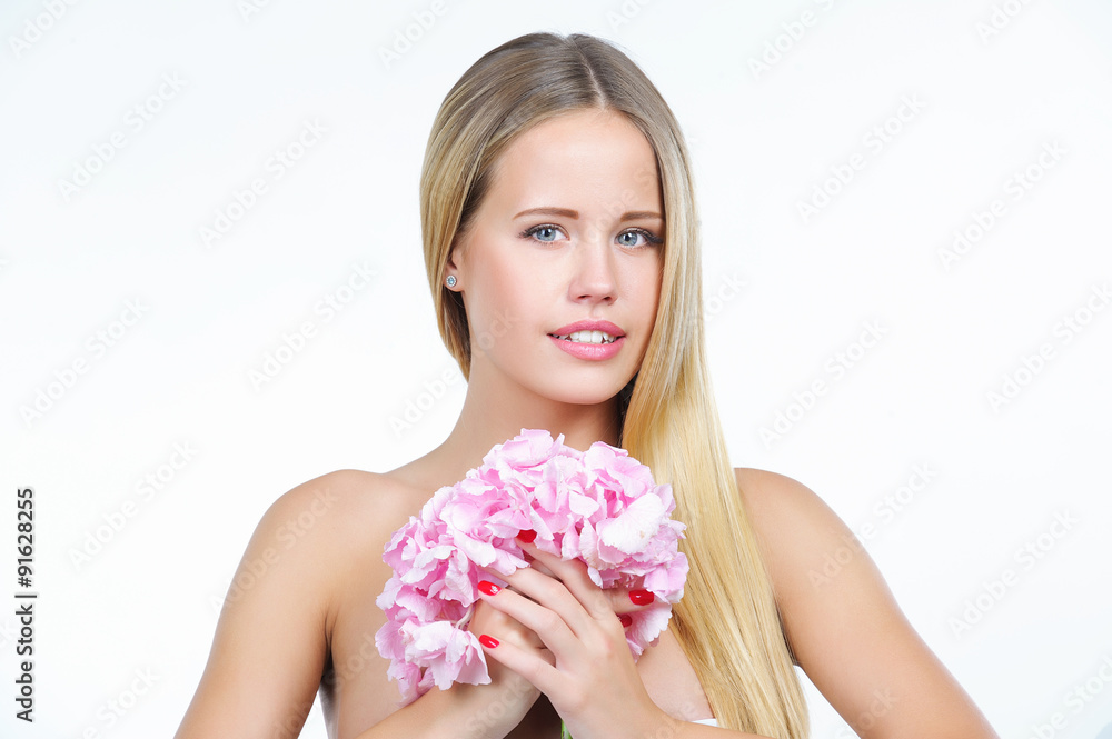 Natural beauty portrait of attractive woman with beautiful fresh skin holding pink flower, isolated on white background