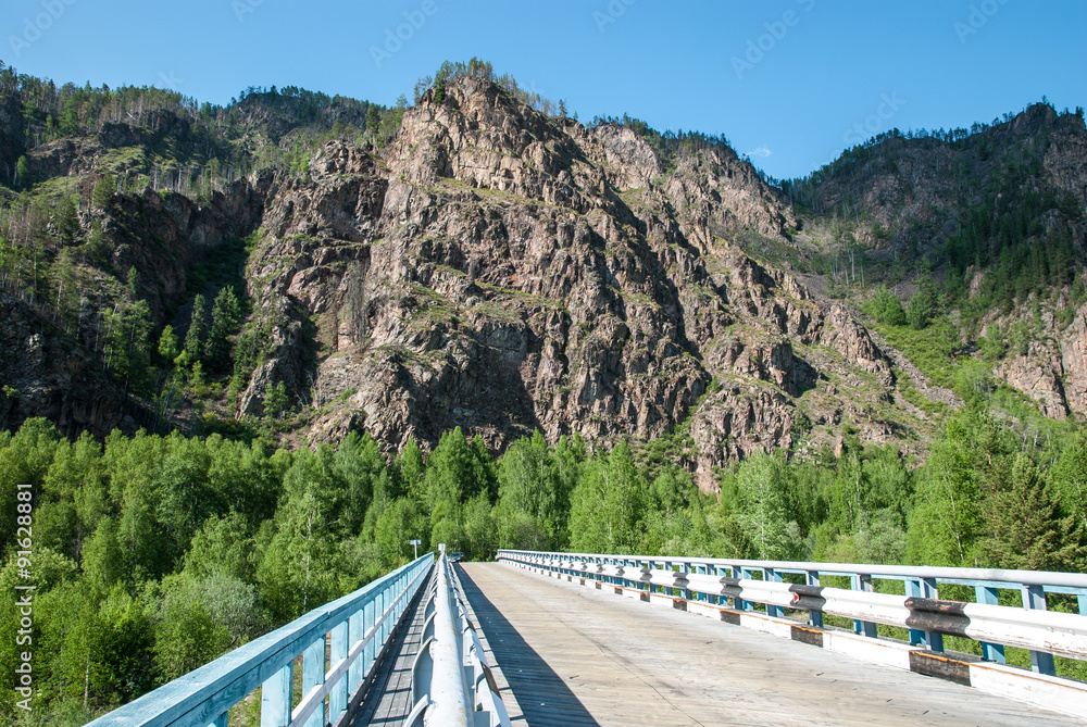 the bridge on the background of mountains