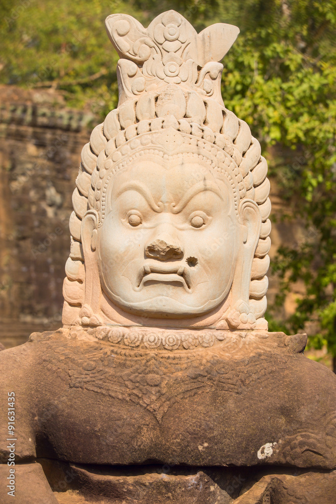 Statue of ancient khmer warrior head at Angkor Wat