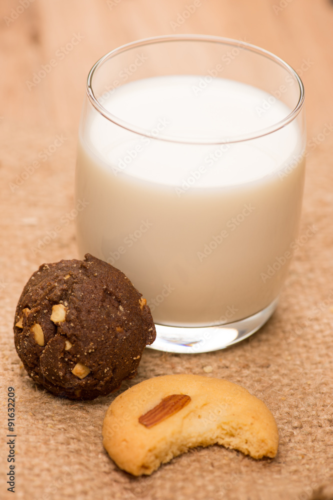 cup of milk wite cookies on wood table cup of milk wite cookies on wood table