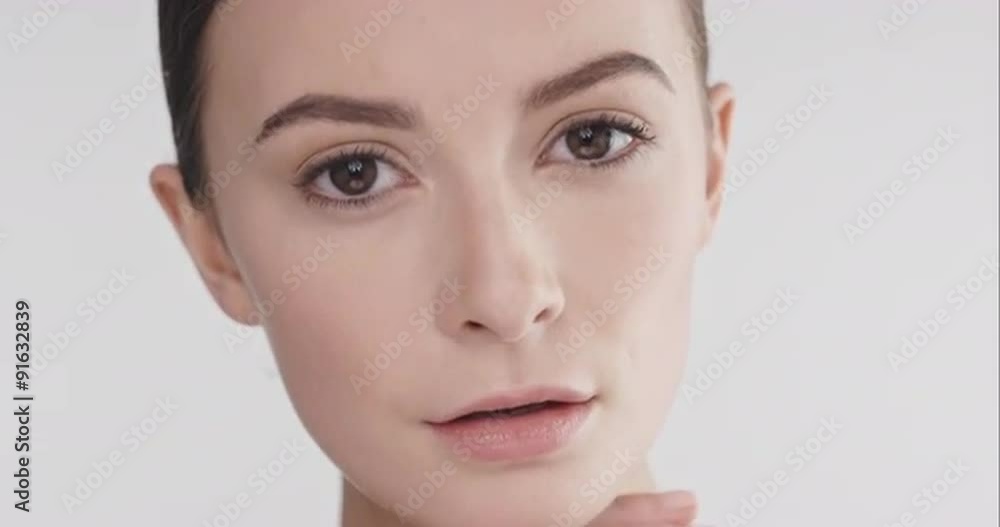 Beauty portrait of woman touching beautiful face in slow motion skincare concept on a grey background shot in 6K Red Epic Dragon Beauty portrait of woman touching beautiful face in slow motion skincare concept on a grey background shot in 6K Red Epic Dragon