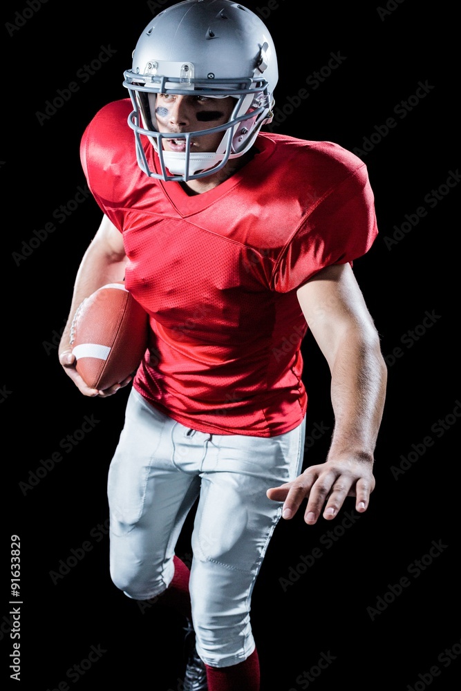 Sportsman running while playing American football