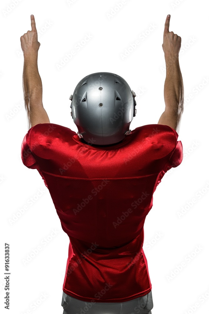 © WavebreakmediaMicro - Rear view of American football player with arms raised © WavebreakmediaMicro - Rear view of American football player with arms raised