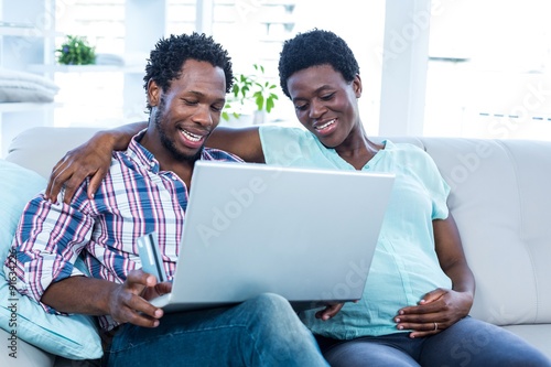 Couple looking at laptop 