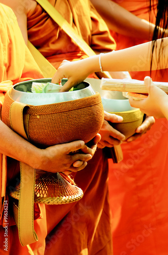 Fotografie Monks collecting alms around the village