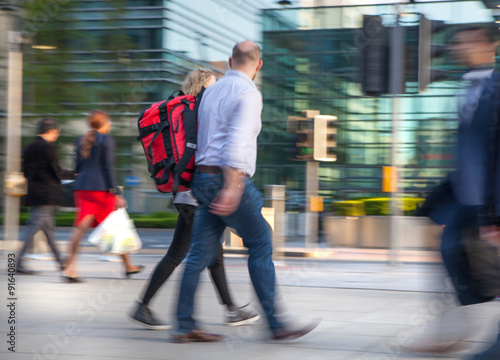 LONDON, UK - MAY 21, 2015: Canary Wharf business life. Business people going home after working day. Blur