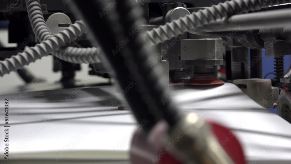 Print sheets are loaded in commercial offset printing press machine. UHD steadycam, 4K stock footage Print sheets are loaded in commercial offset printing press machine. UHD steadycam, 4K stock footage