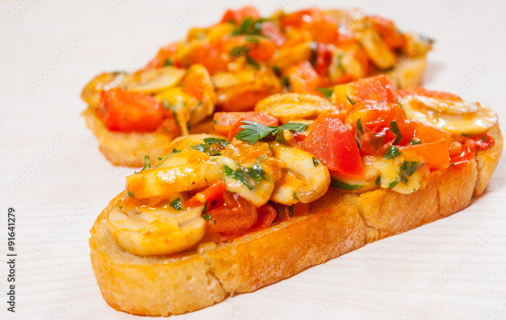 tomato bruschetta with chopped vegetables, herbs, cheese and mushroom on toasted crusty ciabatta bread tomato bruschetta with chopped vegetables, herbs, cheese and mushroom on toasted crusty ciabatta bread