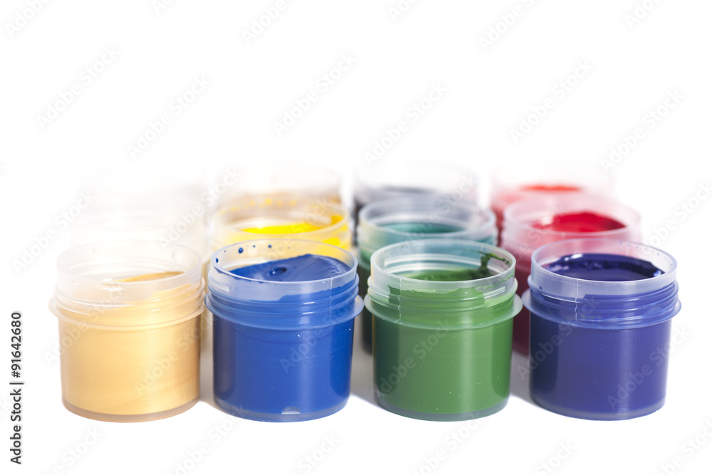 Open colorful cans of gouache paint isolated on white Open colorful cans of gouache paint isolated on white