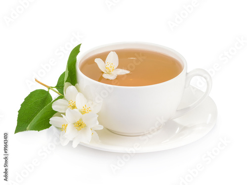 Cup of green tea with jasmine flowers isolated on white backgrou