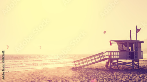 Vintage style picture of lifeguard tower at sunset in Malibu, California, USA. photo