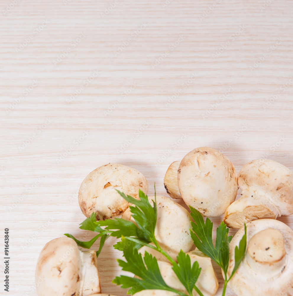 Food background of fresh mushrooms at the wooden board with copy space Food background of fresh mushrooms at the wooden board with copy space
