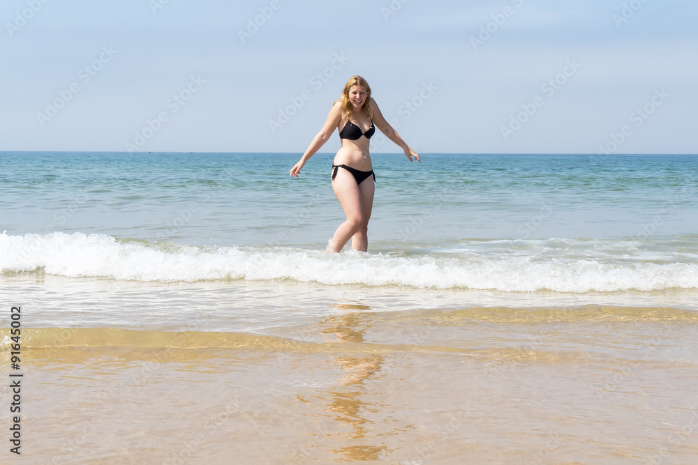 Beautiful young girl enjoying the beach in summer Beautiful young girl enjoying the beach in summer