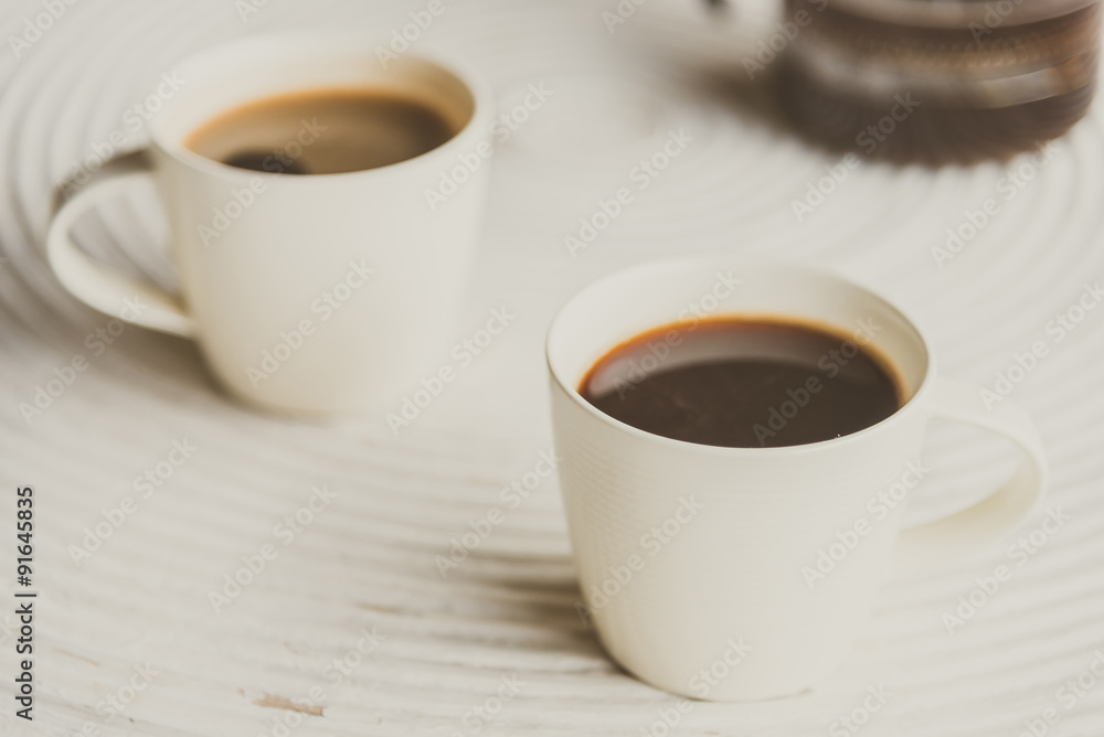 Selective focus point on black coffee in white cup - vintage fil Selective focus point on black coffee in white cup - vintage fil