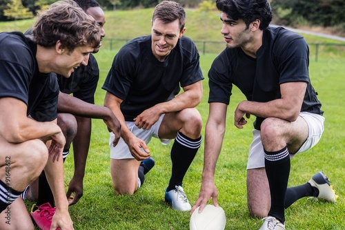 Rugby players discussing their tactics © WavebreakMediaMicro