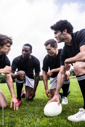 Rugby players discussing their tactics © WavebreakMediaMicro