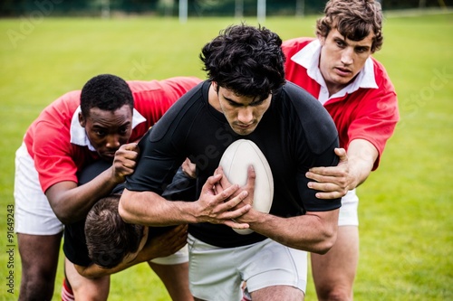 Rugby players tackling during game © WavebreakMediaMicro