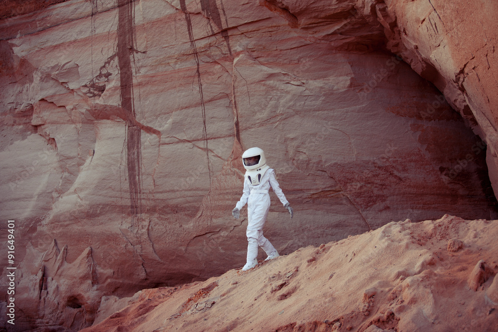 Fototapeta premium futuristic astronaut on another planet, image with the effect of