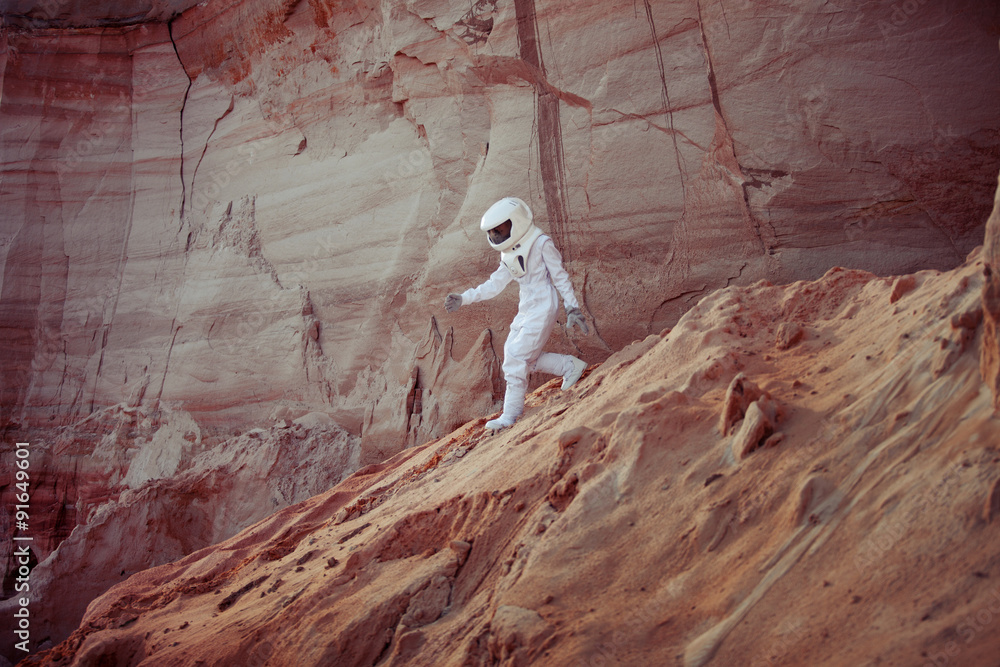 Fototapeta premium futuristic astronaut on another planet, image with the effect of