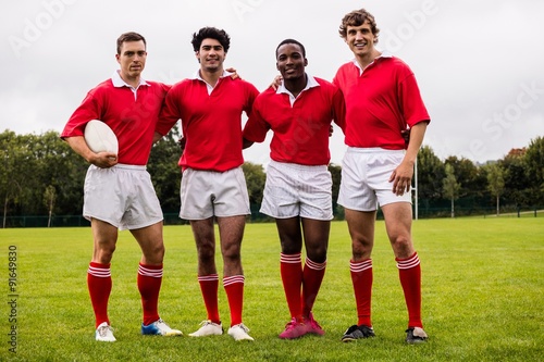Rugby players smiling at camera