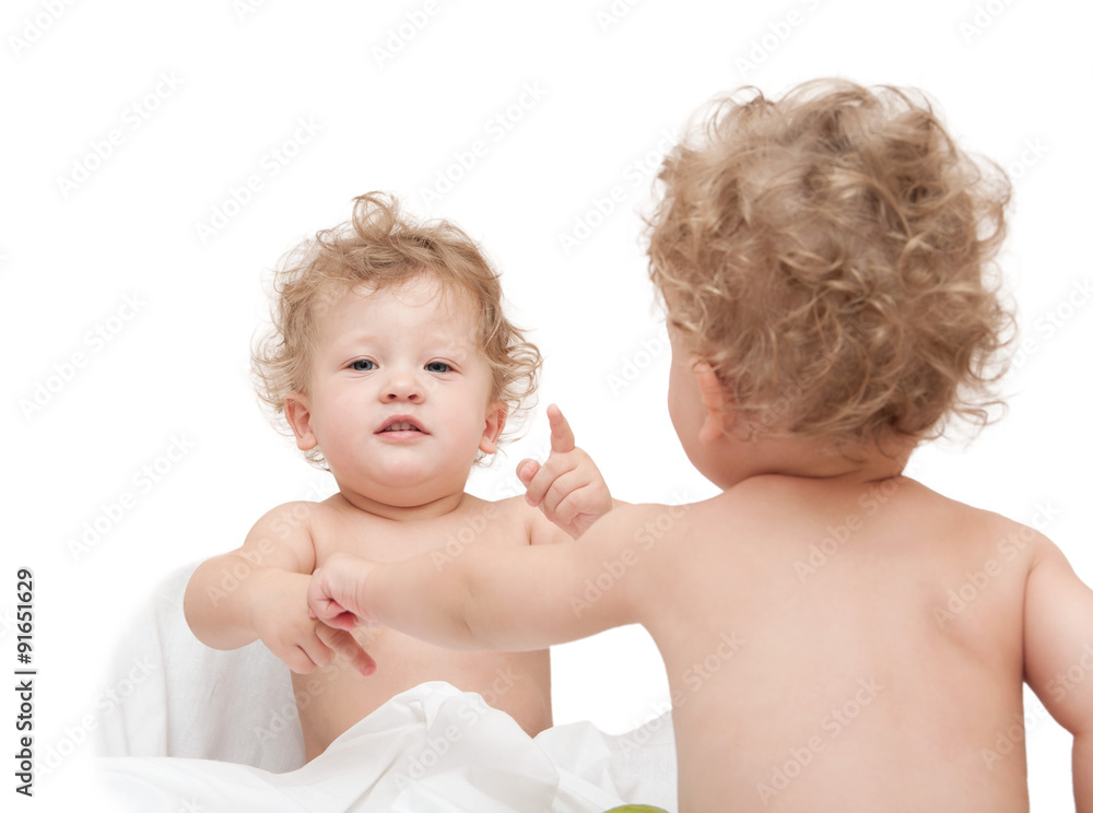 children twins play sitting on a white background children twins play sitting on a white background