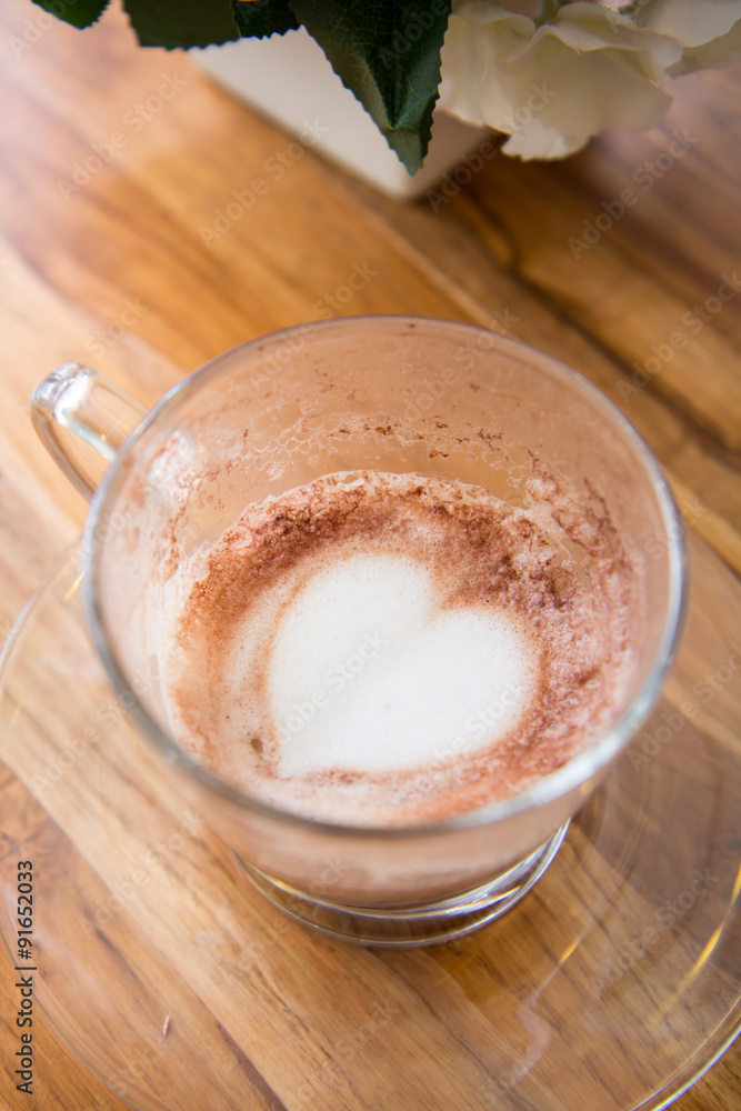 Finish a cup of cappucino with heart shape on bubble milk Finish a cup of cappucino with heart shape on bubble milk