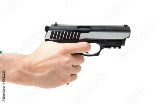 Man's hand holding gun, isolated on white.