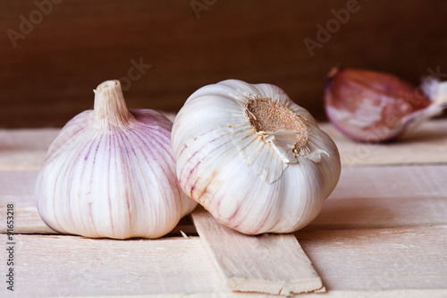 Garlic on wooden boards.