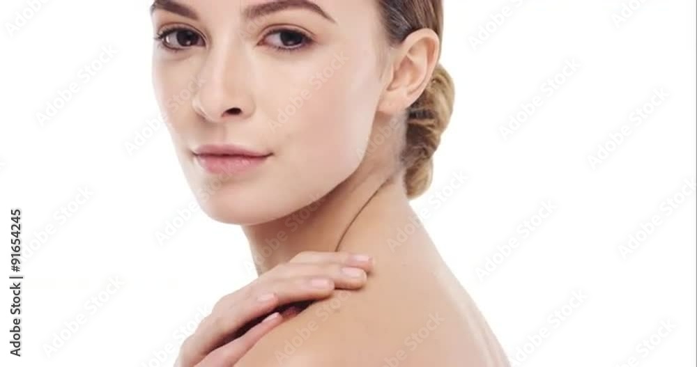 Beauty portrait of woman touching beautiful face in slow motion skincare concept on a white background Beauty portrait of woman touching beautiful face in slow motion skincare concept on a white background