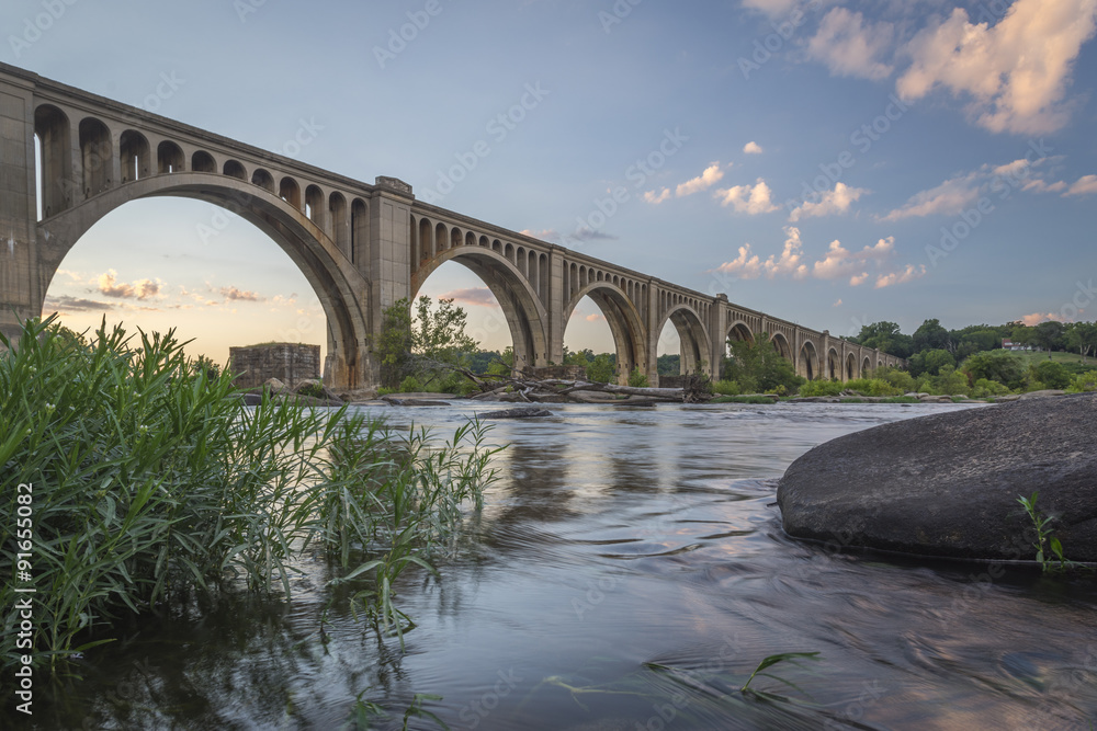 This concrete arch railroad bridge spanning the James River was built by the Atlantic Coast Line, Fredericksburg and Potomac Railroad in 1919 to route transportation of freight around Richmond, VA.