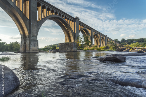 Photo This concrete arch railroad bridge spanning the James River was built by the Atlantic Coast Line, Fredericksburg and Potomac Railroad in 1919 to route transportation of freight around Richmond, VA