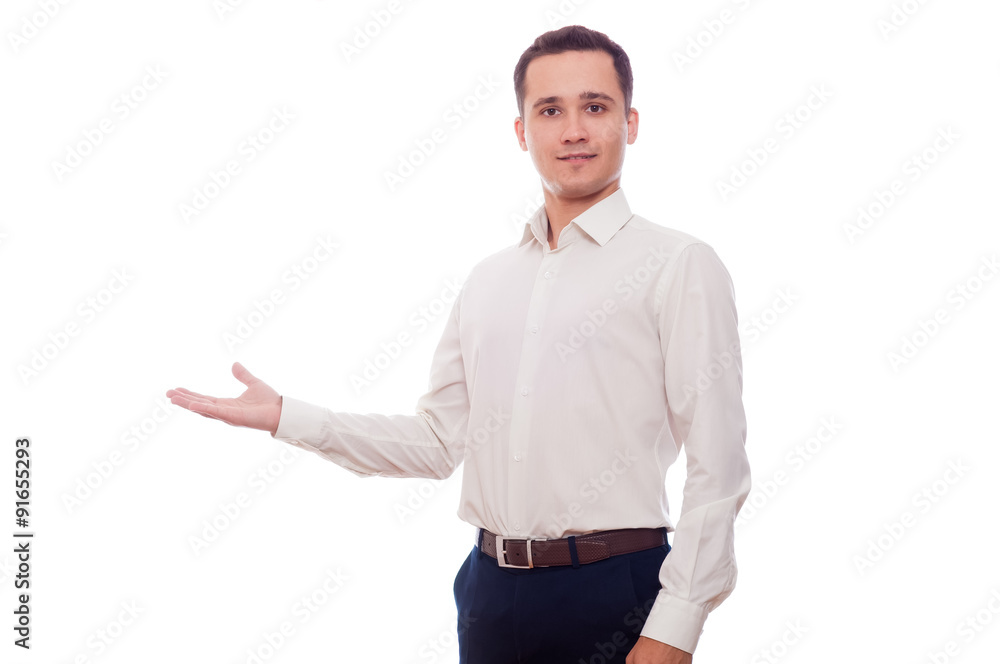 Young man in business suit pointing his arm to the left. Busines Young man in business suit pointing his arm to the left. Busines