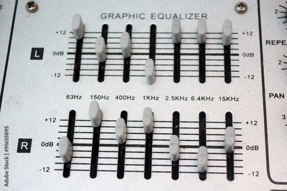 Detail of a music mixer desk with various knobs or slides. shallow depth of field Detail of a music mixer desk with various knobs or slides. shallow depth of field