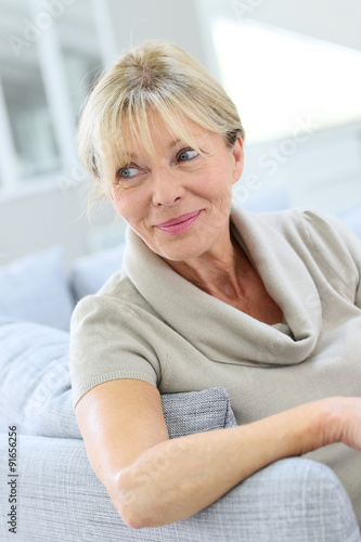 Portrait of senior woman relaxing in couch