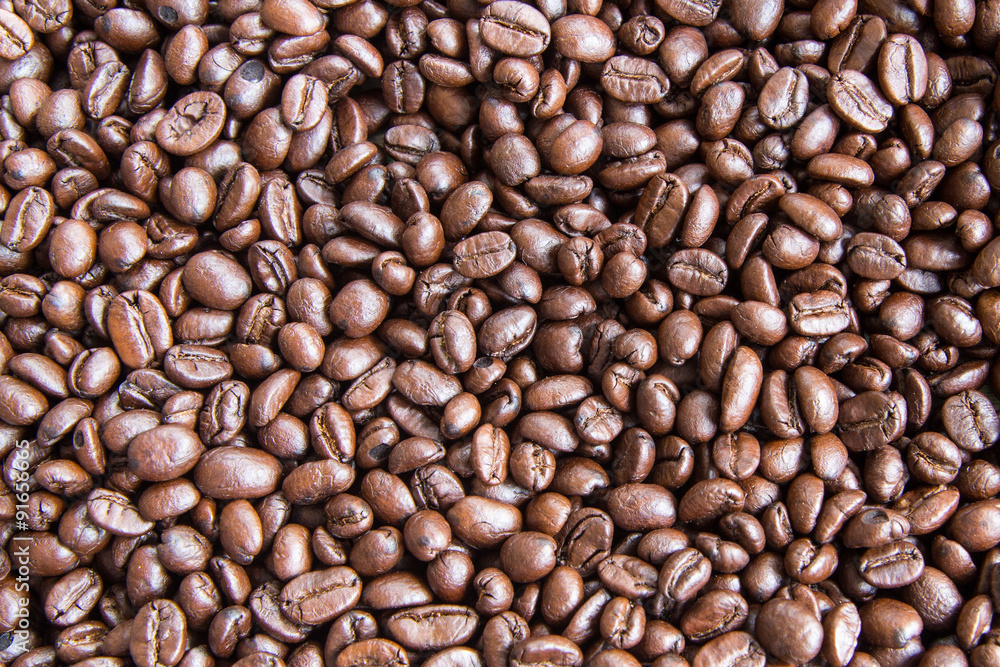 Obraz premium Roasted coffee background, close-up