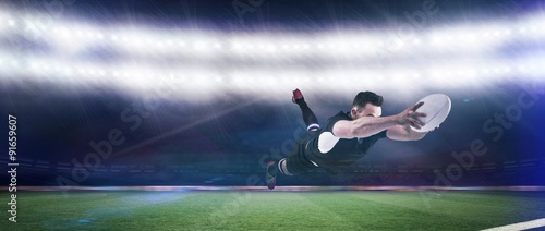 Composite image of rugby player scoring a try