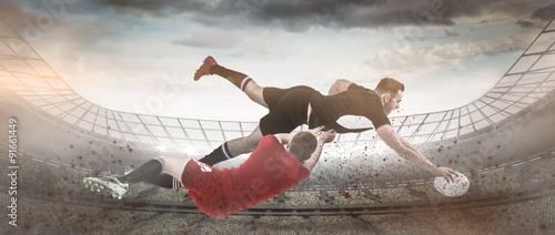 Composite image of a rugby player scoring a try