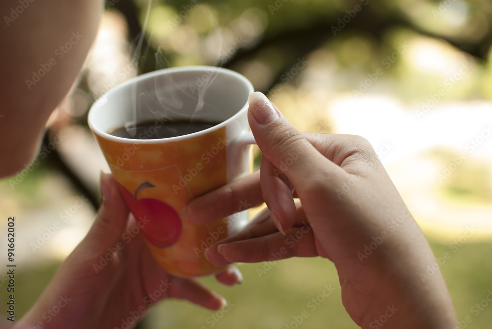 Close-up of person's hand with coffee cup Close-up of person's hand with coffee cup