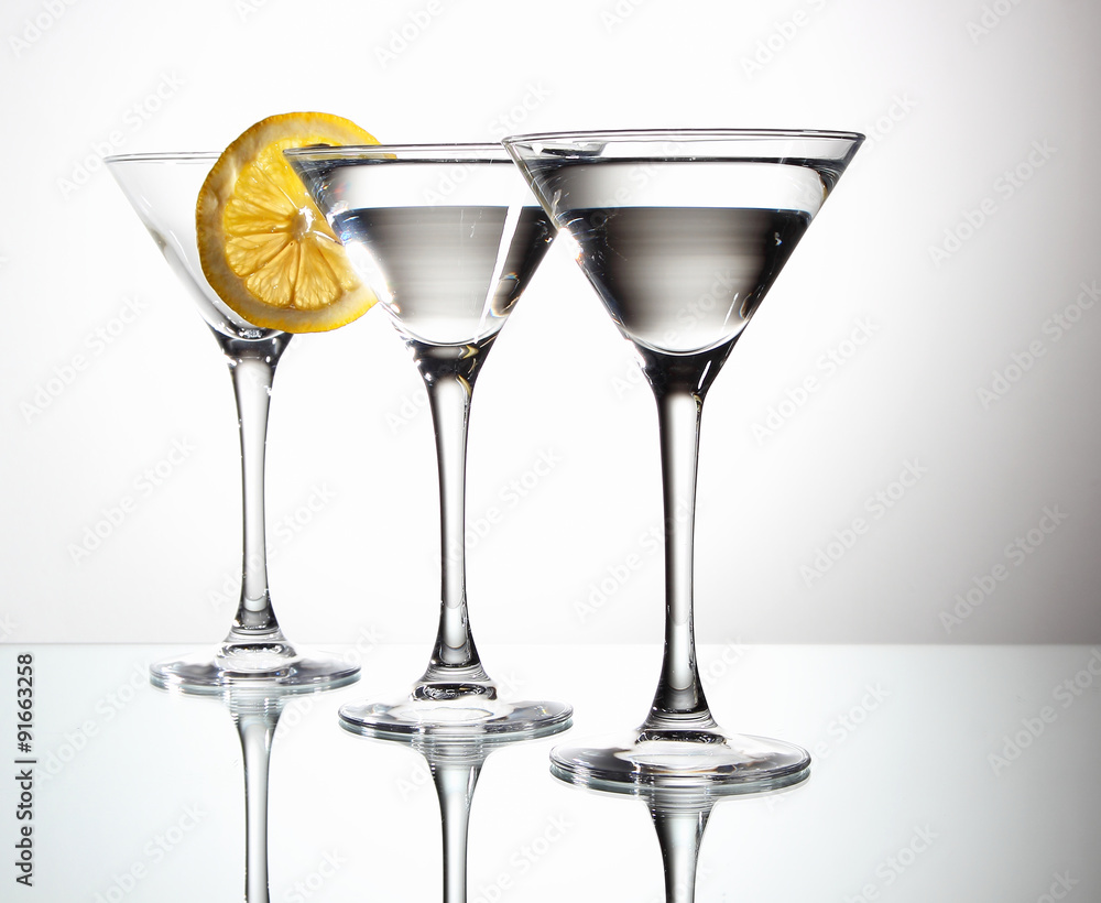 Glasses of martini and slice of lemon..