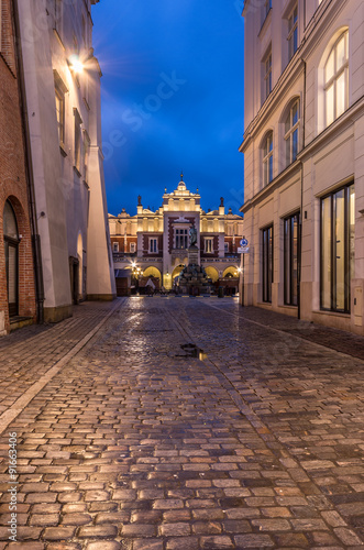 Old street paved with granite stones in Krakow old town © tomeyk