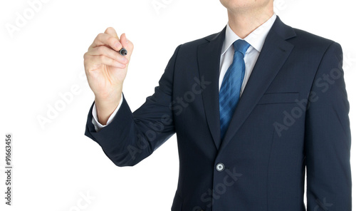 Young businessman writing something on white background