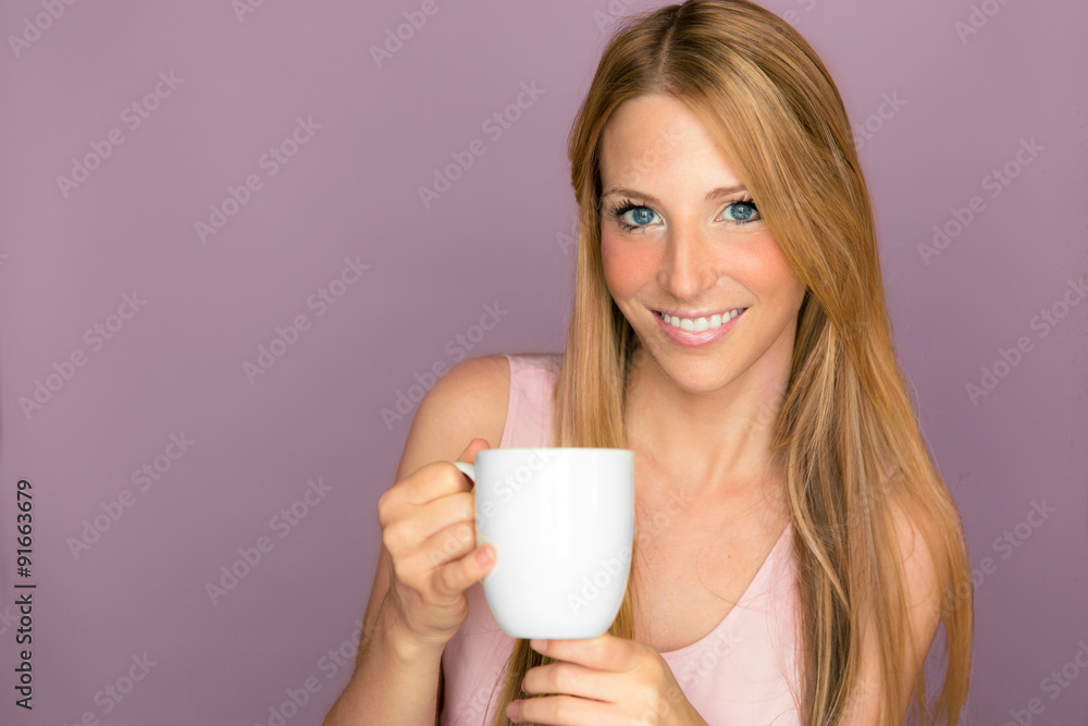 Portrait of a beautiful woman smiling with cup of coffee tea plain pink purple backdrop isolated youthful pretty teeth hair Portrait of a beautiful woman smiling with cup of coffee tea plain pink purple backdrop isolated youthful pretty teeth hair