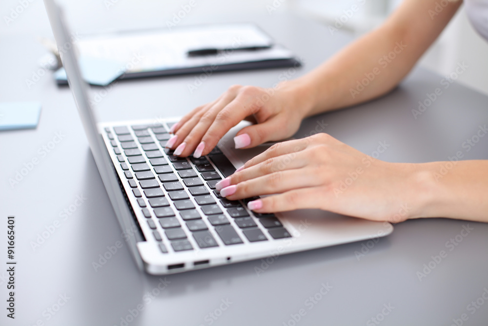 Close up of business woman hands typing on laptop computer Close up of business woman hands typing on laptop computer