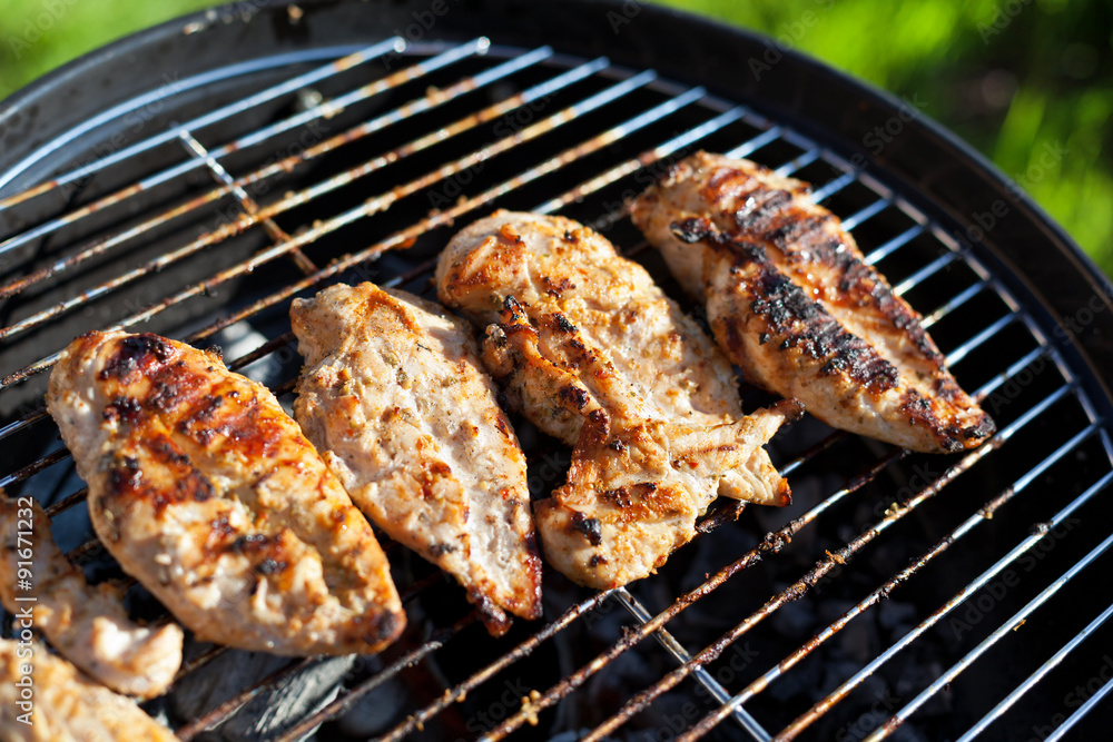 Grilled chicken breast on barbeque