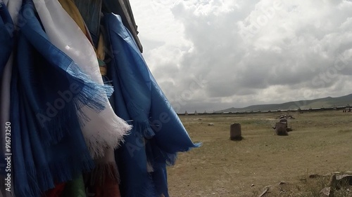 long prayer blue flags flutter in the wind at a Buddhist monastery in column
Erdene Zuu Buddhist monastery - one of the oldest monuments of Mongolia photo