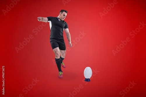 Composite image of rugby player kicking the ball © vectorfusionart