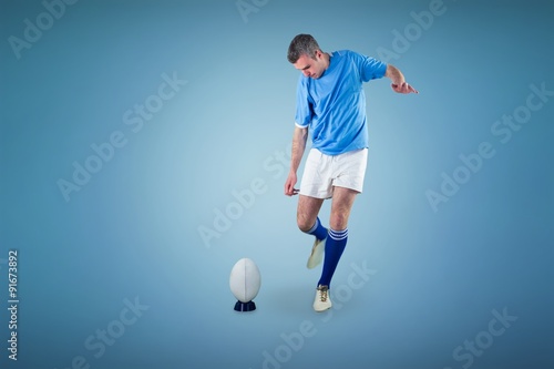Fototapeta Naklejka Na Ścianę i Meble -  Composite image of rugby player doing a drop kick