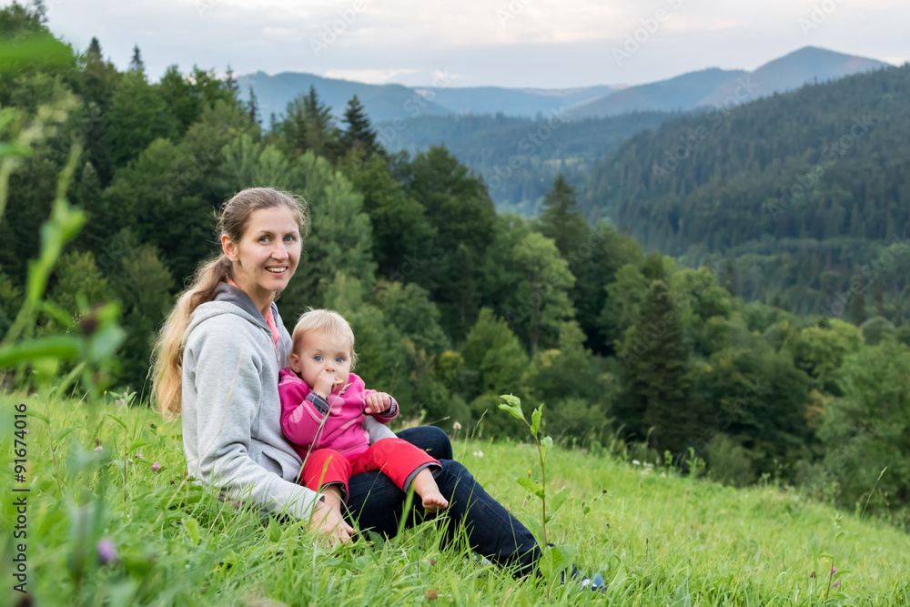Mum with child on background of mountains Mum with child on background of mountains
