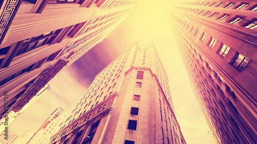 Vintage filtered photo of skyscrapers in Manhattan at sunset, New York, USA.