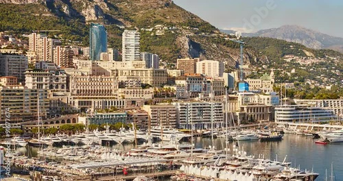 Monaco, Monte-Carlo, 07.09.2015: Port Hercules at sunset, port de Hercule, luxury yachts, big boat, yacht show, mediterranean sea, time-lapse 4k video, motor boat, princes palace of monaco photo